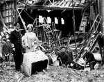 George VI and wife inspecting bombing damage during WWII